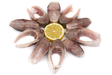 Slices of fish and lemon isolated on white background