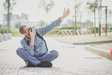 handsome hipster casual multitasking modern man with vintage cam