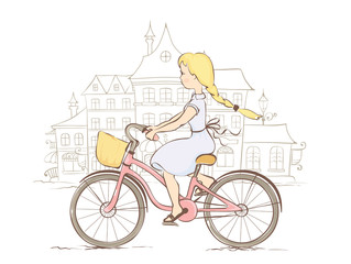 Fototapeta na wymiar Girl on a bicycle in a European city