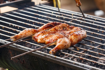 Roasted chicken on barbecue grills