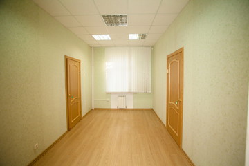 corridor with two wooden doors