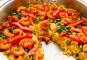 paella with shrimps, partially eaten