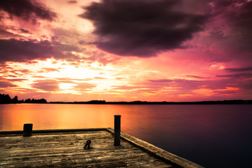 pier at lake and a beautiful sunset