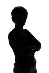 Silhouette of a woman looking at camera