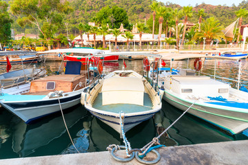 Obraz premium small fishing boats in the port city