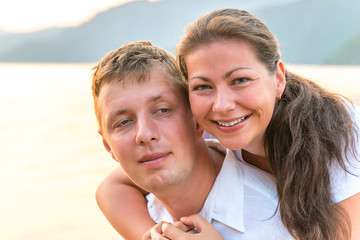 portrait of a happy young couple at the sea