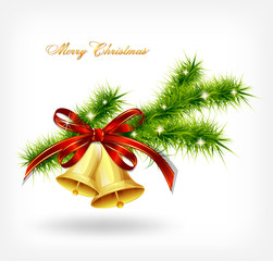 Golden bell with red bow hanging on a green spruce branch