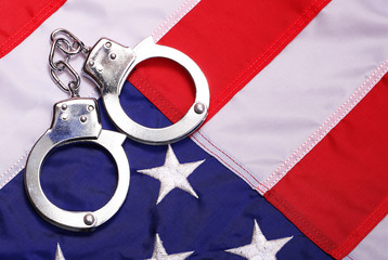 Handcuffs and American Flag