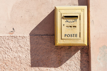 Yellow letter box of the moroccan post in Marrakesh, Morocco
