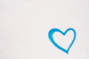 Heart shape painted on frozen window
