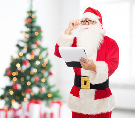 man in costume of santa claus with notepad
