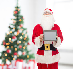 man in costume of santa claus with tablet pc