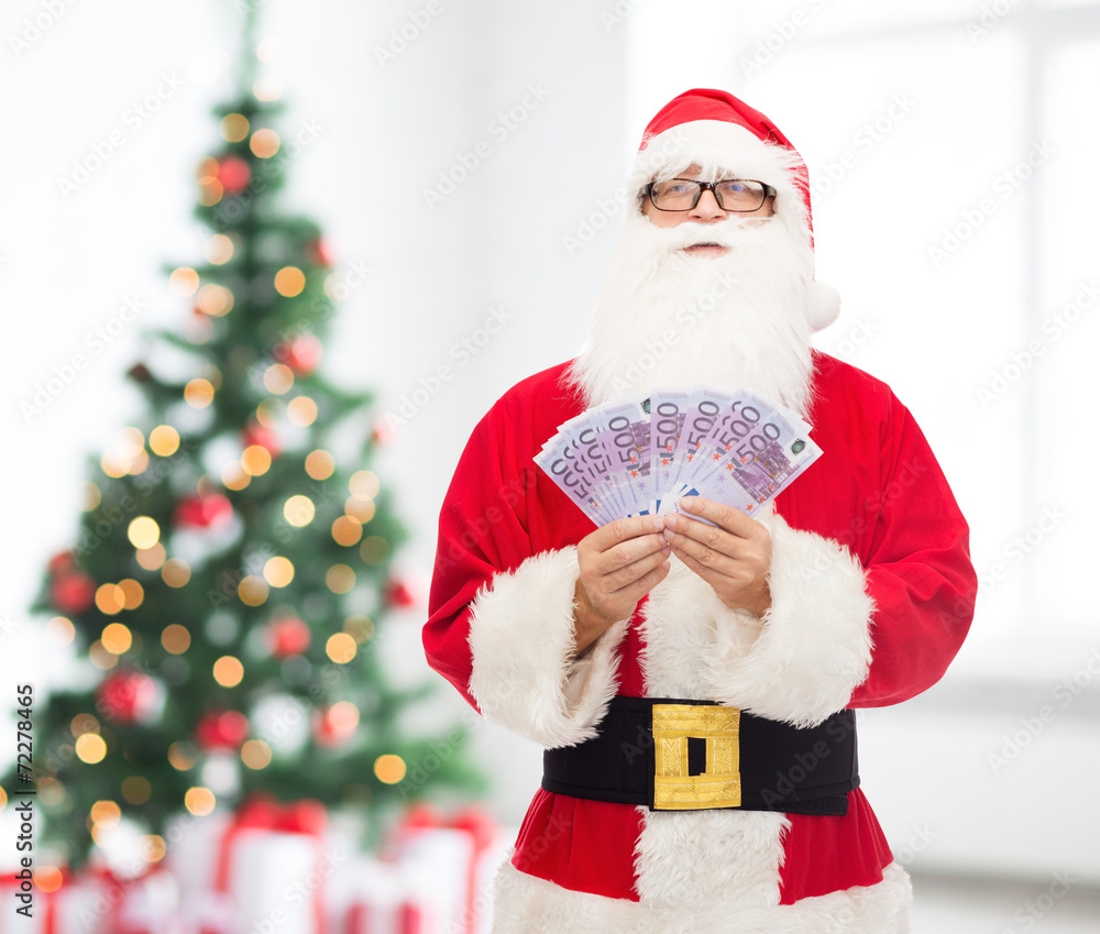 Canvas Prints man in costume of santa claus with euro money