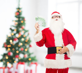 man in costume of santa claus with euro money