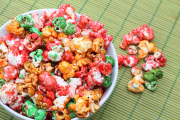 Colorful sugared popcorn in white bowl