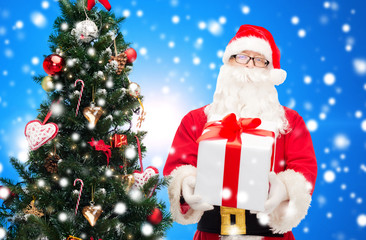 man in costume of santa claus with gift box