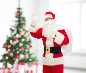 man in costume of santa claus with bag