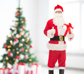 man in costume of santa claus with gift box