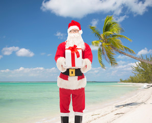 man in costume of santa claus with gift box