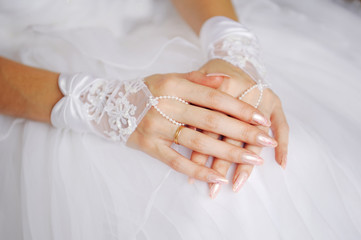 elegant bride's hands with golden ring