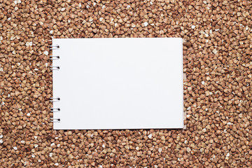 buckwheat with blank notepad
