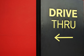 yellow drive thru text with arrow