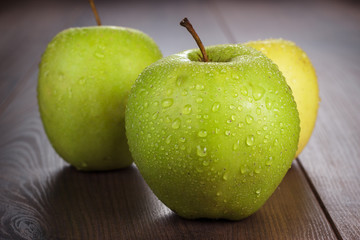 fresh green apples on the table
