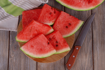 Slice of watermelon on wooden table