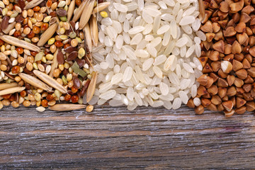 Groats on wooden background