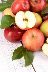 Ripe red apples on wooden background