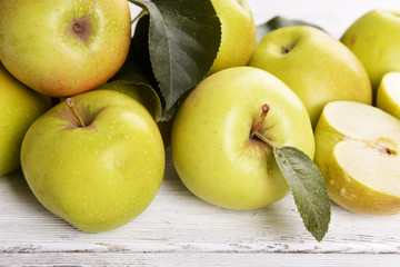 Ripe green apples on wooden background