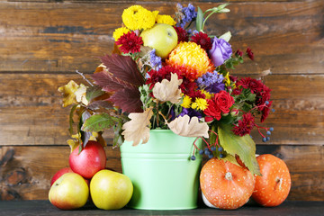 Beautiful autumn composition on wooden background