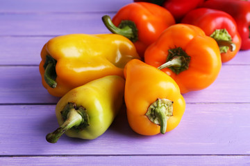 Pepper on wooden background