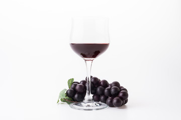 Red wine and grapes