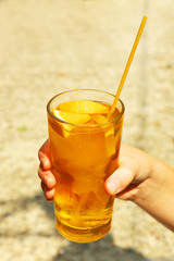 Refreshing cocktail in hand