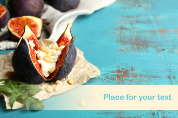 Ripe sweet fig with cottage cheese on wooden background