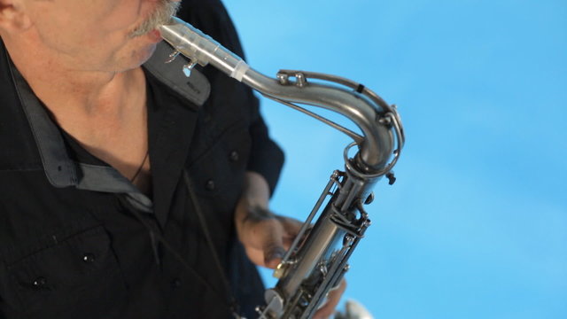 Top view of man playing the saxophone