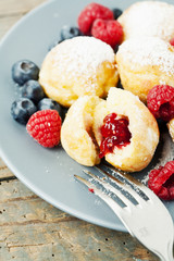 Traditional danish pancakes - ebelskivers with fresh berries