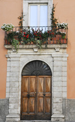 Fototapeta na wymiar Door with balcony above