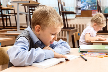 Schoolchildren in empty classroom