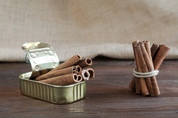 Tin can with cinnamon sticks