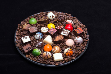 Set of a various chocolate pralines and coffee beans