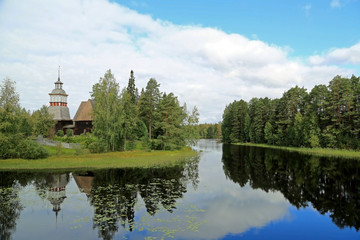Fototapeta na wymiar Landscape with the Old Church of Petajavesi, Finland