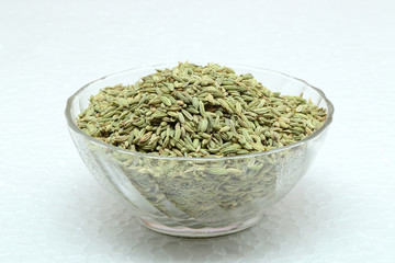 Fennel seeds on a white background