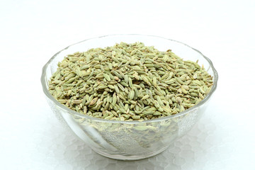 Fennel seeds on a white background