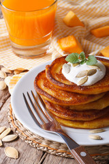 Healthy breakfast: pumpkin pancakes and juice closeup.