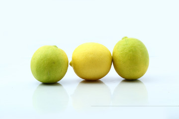 Fresh Three lemons isolated on white