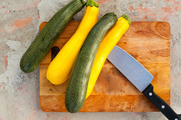 Sliced zucchini on wooden cutting board