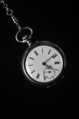 old pocket watch in black and white
