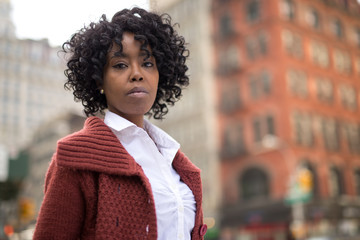 African American black woman in city serious face